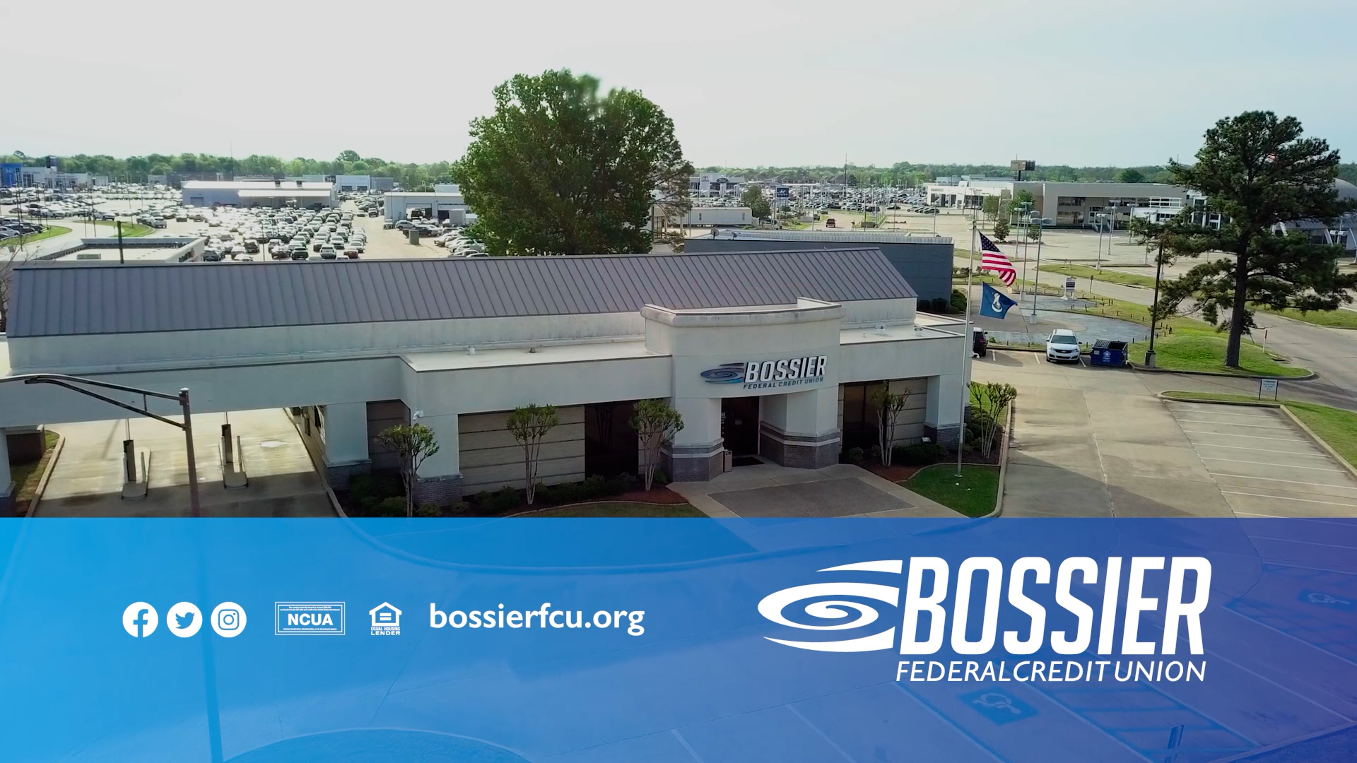 Aerial drone shot of a Bossier Federal Credit Union branch location with the branded end card graphic.