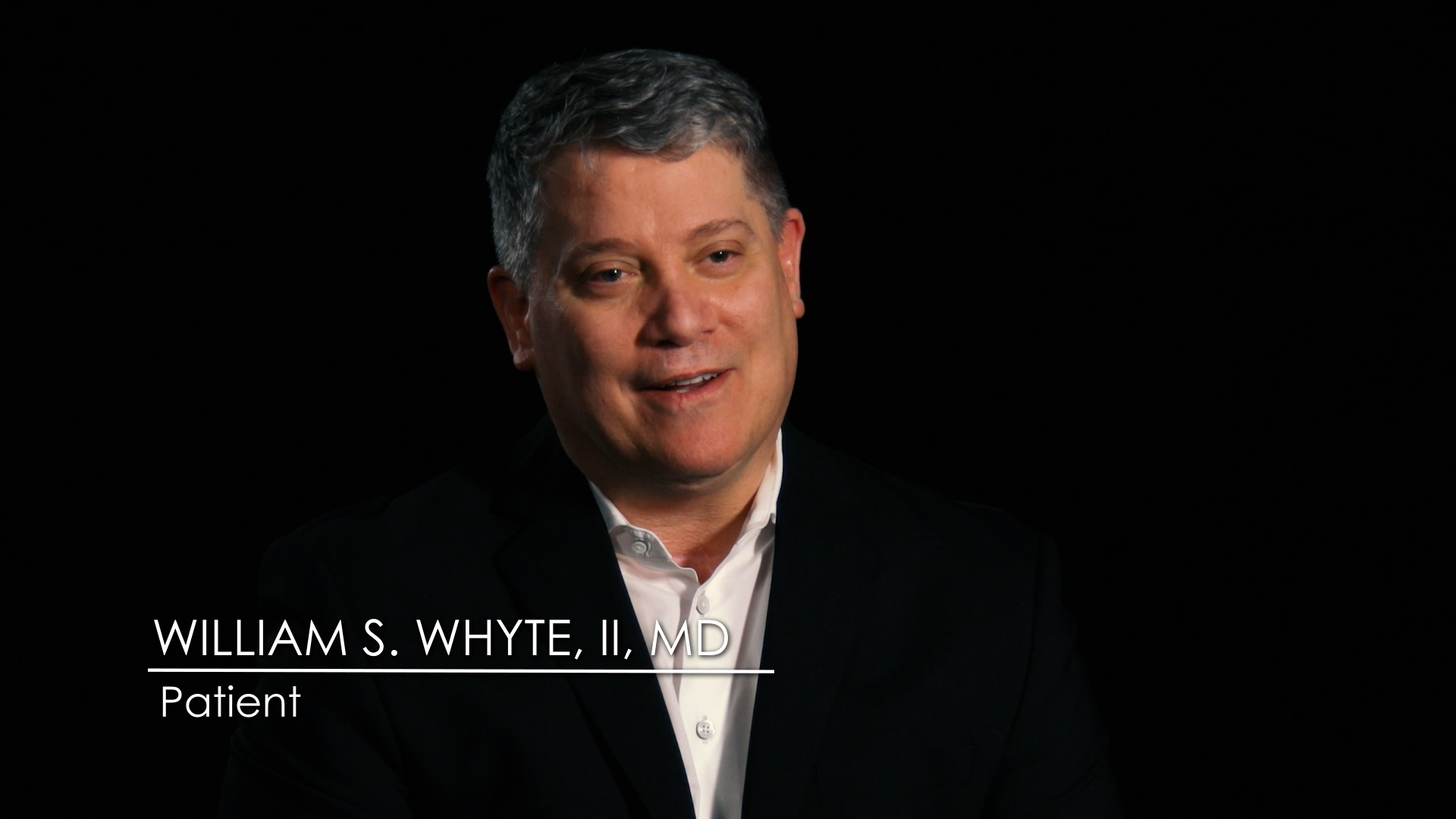 Doctor William S. Whyte, II, MD speaks to camera in a black-background interview, identified onscreen as a patient.